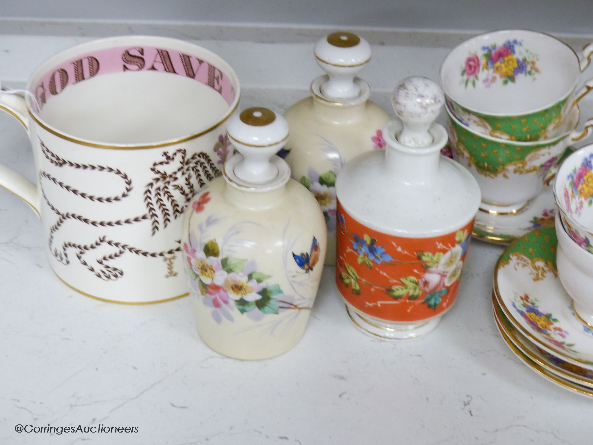 A Paragon tea set, three ceramic perfume bottles and stoppers and a Wedgwood commemorative mug